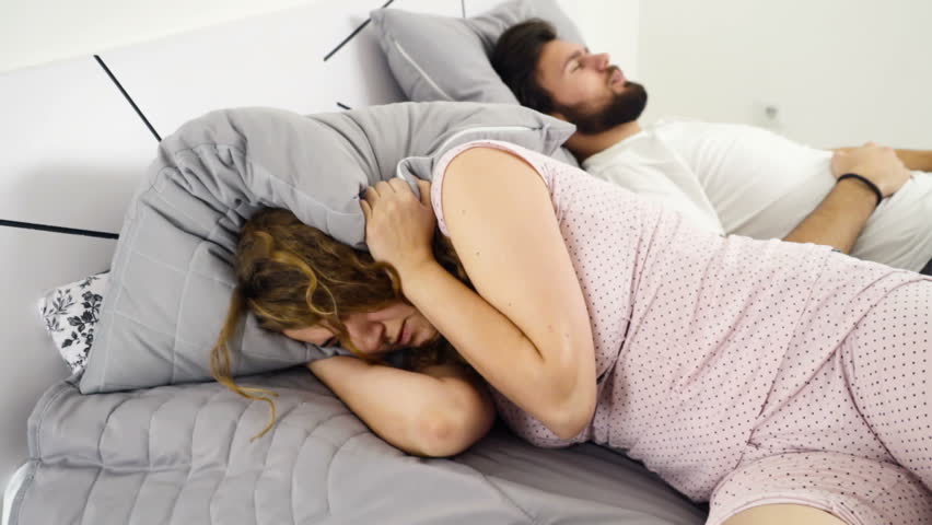Hd00 21woman Hiding Her Head Under The Pillow While Sleeping With