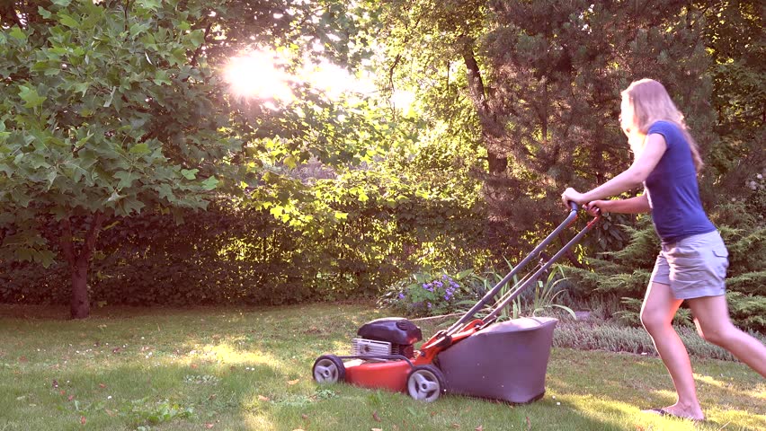 Beautiful Barefoot Woman In Dress And Hat Mowing Lawn Grass In ...