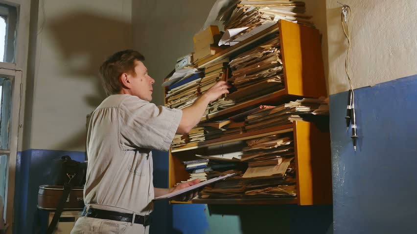 Accounting Clerk Old Man Retro Touches The Paper In An Old Office Stock ...