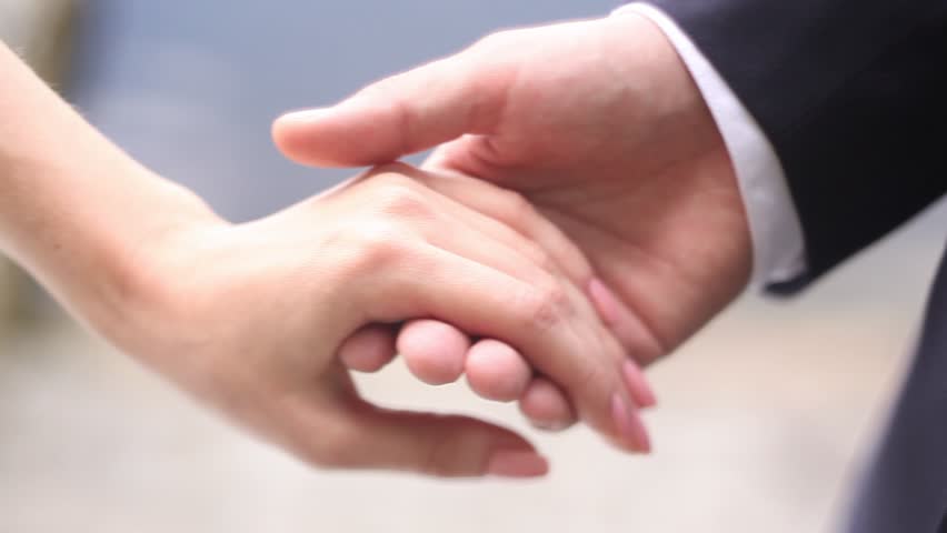 male hand holding the girls hand then lightly squeezes in his hand the bride - Wedding Rings On Hands male hand holding the girls hand then lightly squeezes in his hand the bride - Wedding Rings On Hands