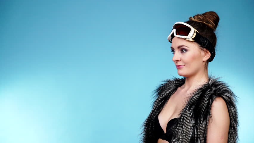 Woman Sexy Hot Skier Girl Wearing Black Bra Fur Vest Ski Googles Portrait Winter Sport Activity Beautiful Seductive Sportswoman On Blue Studio Shot 4k Woman Sexy Hot Skier Girl Wearing Black Bra Fur Vest Ski Googles Portrait Winter Sport Activity Beautiful Seductive Sportswoman On Blue Studio Shot 4k