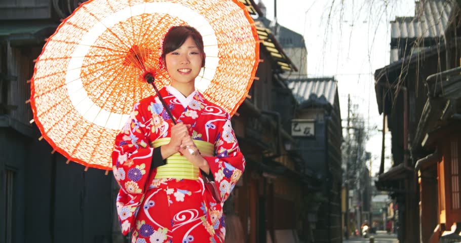 Japan - March 2011: Japanese Geisha Performer Posing With 