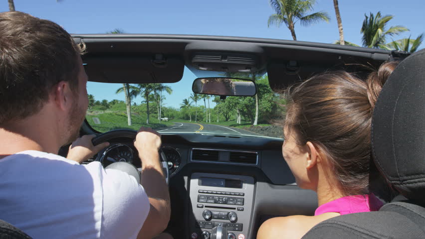 Car Couple Driving On Road Trip Travel Vacation In Convertible. Young ...