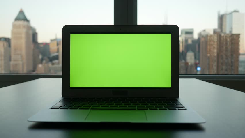 Laptop Computer With Isolated Green Screen Background. Modern City ...