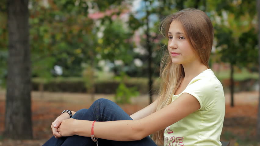 Stock Video Clip Of Sad Upset Teenage Girl Sitting On Bench