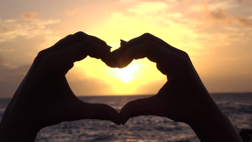 Ocean Sunset Shining Through Heart Shaped Hands Stock Footage Video ...