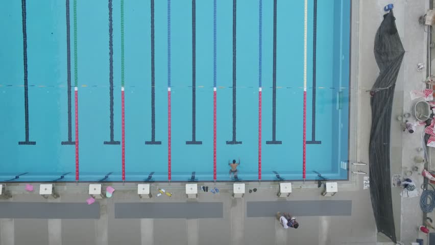 Olympic Swimming Pool 2015 moscow, russia - april 19, 2015: athletes swim butterfly during Olympic Swimming Pool 2015 moscow, russia - april 19, 2015: athletes swim butterfly during
