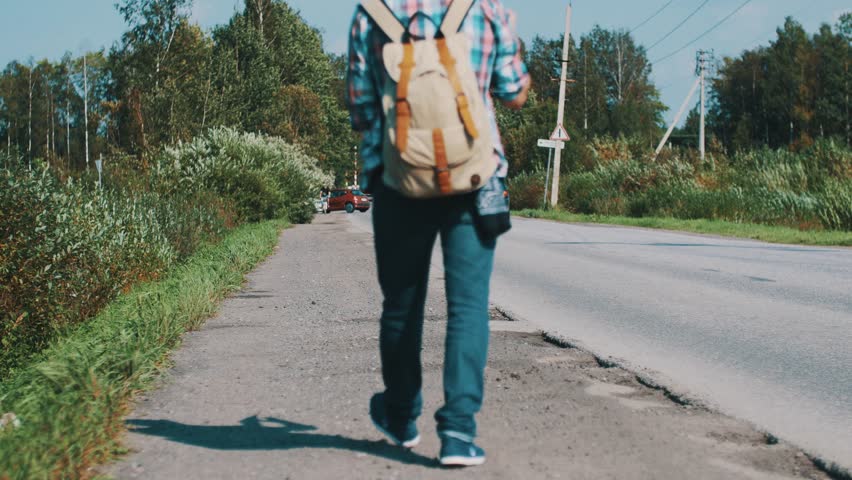 Boy hitchhiking — img 9
