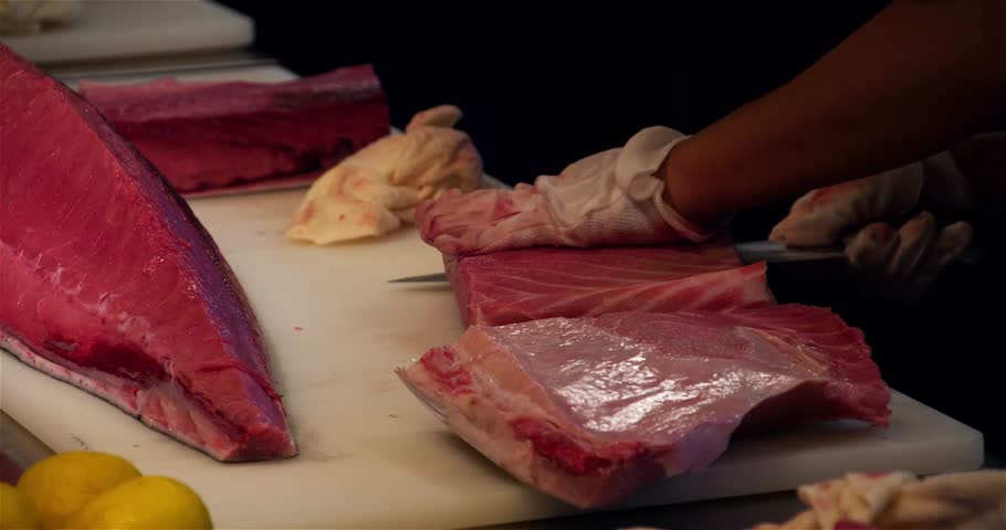 Restaurant Kitchen Video the chef handles fire pieces of fish in a restaurant kitchen Restaurant Kitchen Video the chef handles fire pieces of fish in a restaurant kitchen