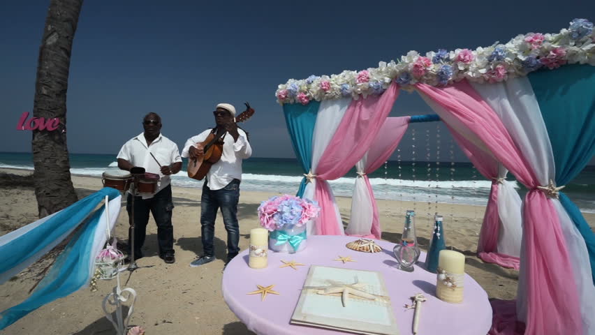 Afro American Musicians With Guitar And Small Drum Are Play Music