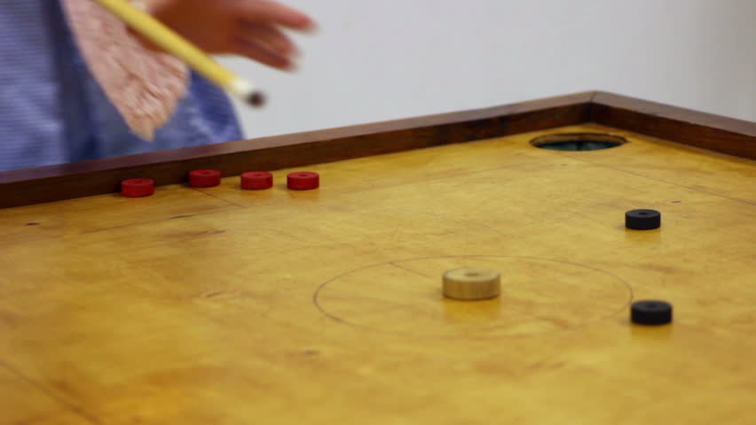 Two Friends Playing Carrom Game, Strike And Pocket Table Game ... Two Friends Playing Carrom Game, Strike And Pocket Table Game ...