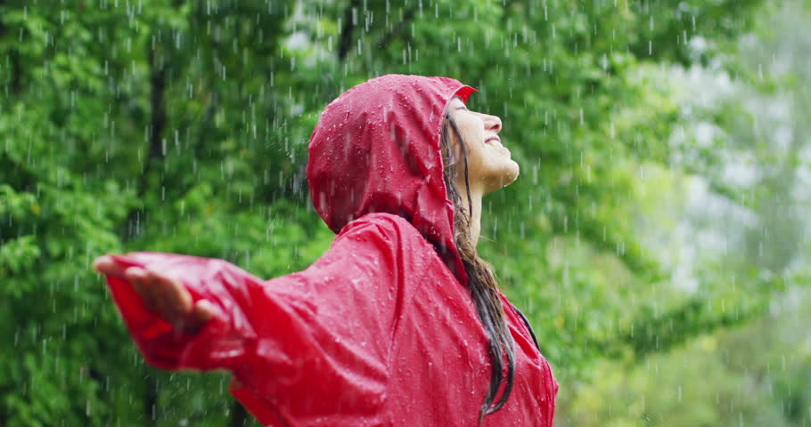 happiness and rain. A happy woman smiles in the… - Royalty Free Video