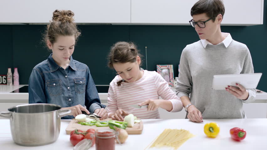 Mom Teaching Kids To Cook A Meal Stock Footage Video