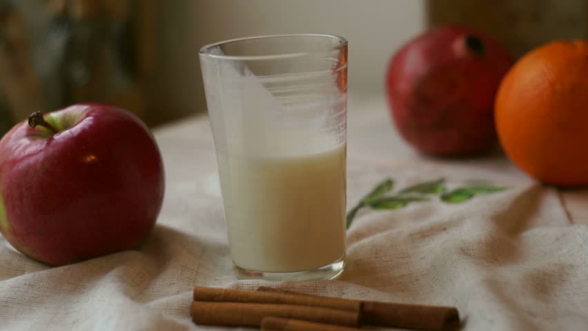 Kitchen Table Close Up breakfast food on tablecloth at kitchen table. milk glass, red Kitchen Table Close Up breakfast food on tablecloth at kitchen table. milk glass, red