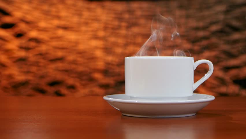 cup of coffee with smoke on table at coffee shop stock footage cup of coffee with smoke on table at coffee shop stock footage