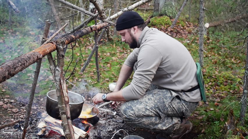 Hunter Man Cooks Food From Stock Footage Video 100 Royalty Free 22392808 Shutterstock - 