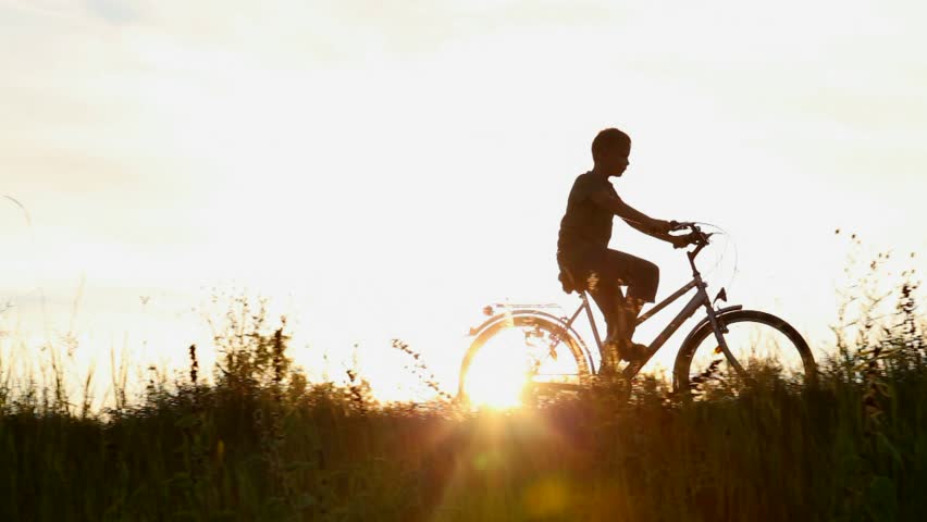 Little Kid Riding Bike In Summer Meadow Landscape At Beautiful Sunset ...