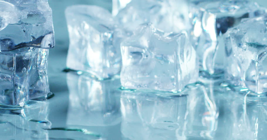 Macro Shot Of Pure Water Ice Cubes That Melt In Slow Motion On White ...