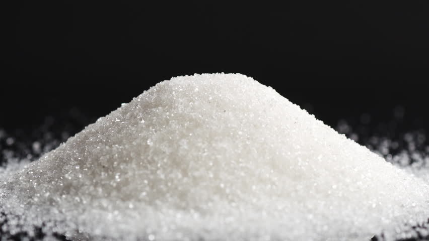 Pile Of Sugar On Black Background Shooting With High Speed Camera ...