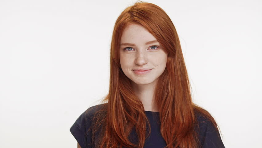 Shy Coy Ginger Caucasian Teenage Girl Standing Smiling On White Background Stock Footage Video