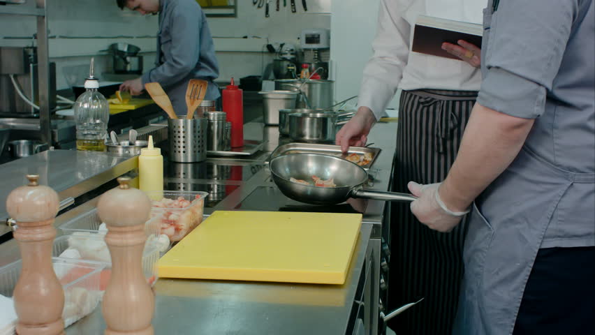Restaurant Kitchen Video chef in the restaurant kitchen ; cook in the restaurant's kitchen Restaurant Kitchen Video chef in the restaurant kitchen ; cook in the restaurant's kitchen