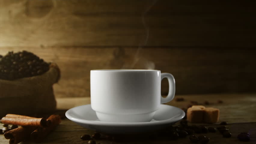 cup of coffee with smoke on table at coffee shop stock footage cup of coffee with smoke on table at coffee shop stock footage