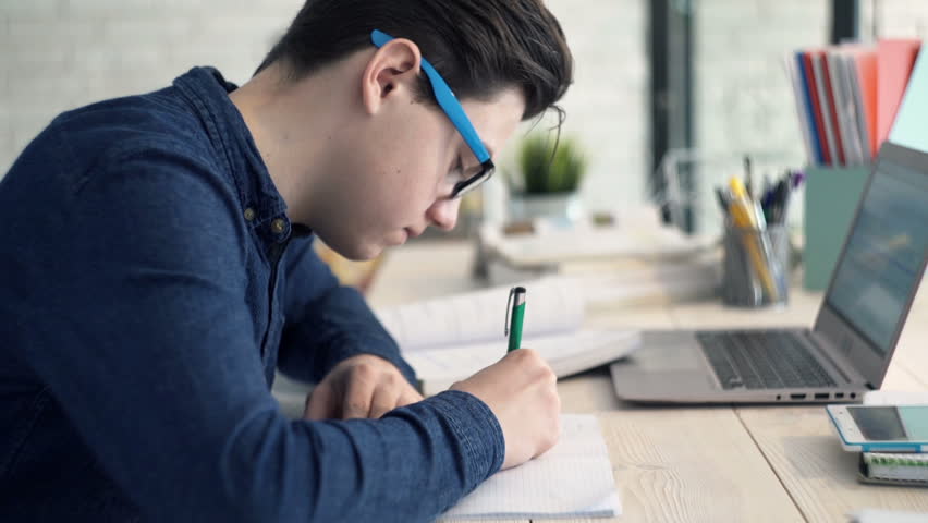 Child doing her homework stock photo. Image of assignment 