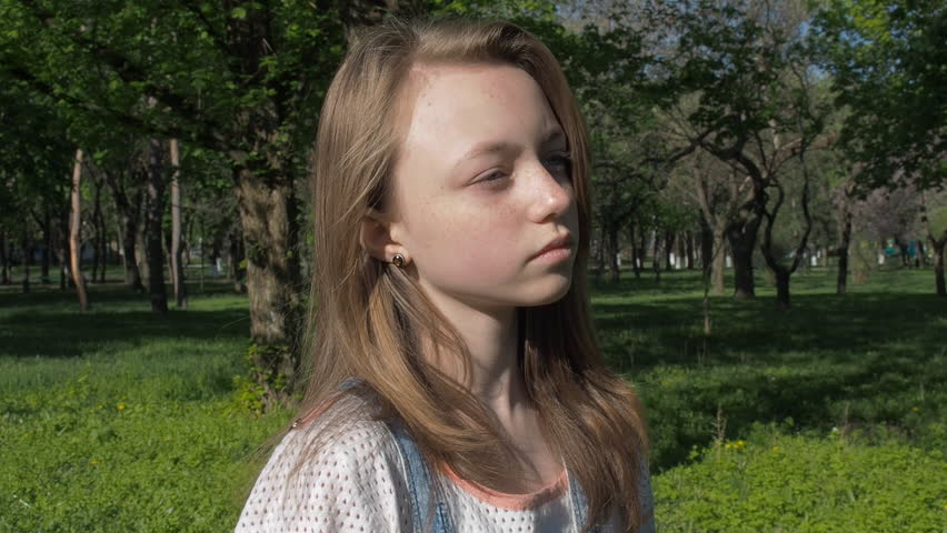 Close Up Portrait Of Young Woman Smiling In Nature Wit