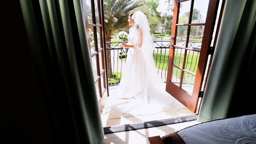 Bride In Traditional White Wedding Dress On Balcony Luxury Home