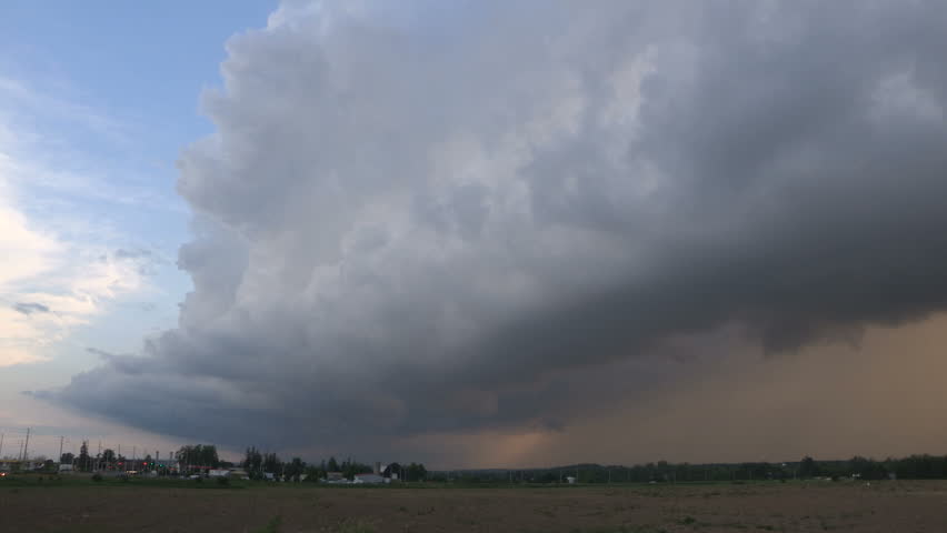 Distant Microbursts. Intense Storm Updrafts Veiled By Pileus With ...