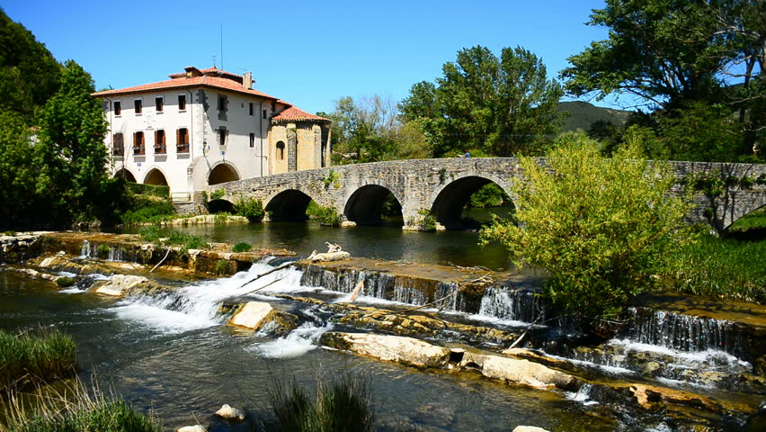 Stock video of medieval bridge over river ulzama,villava, spain