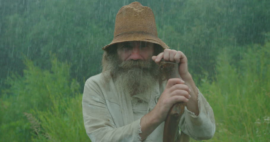 4k00 08pleasant Old Man With Long Gray Beard And In Old Clothes Is