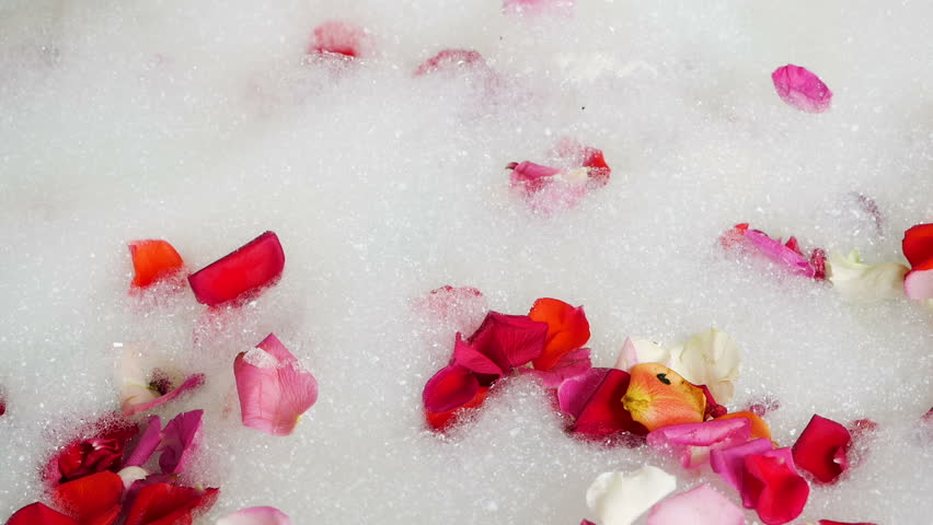 Round Bubble Bath Are Rose Petals And Goes To Shower With Water Stock