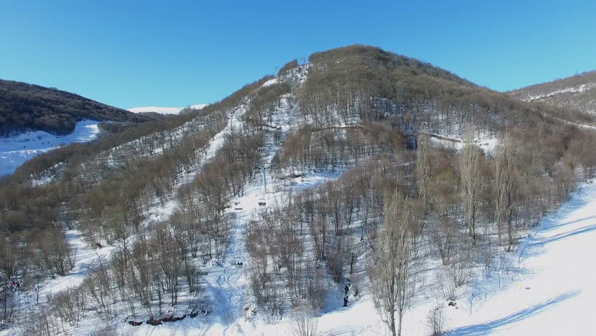 4k00 08cabins Of Ropeway Move By Snowy Mountain Slope At Winter