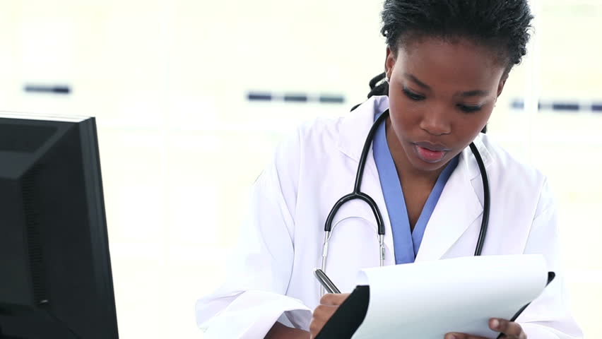 Black Female Doctor Writing On Stock Footage Video (100% ...