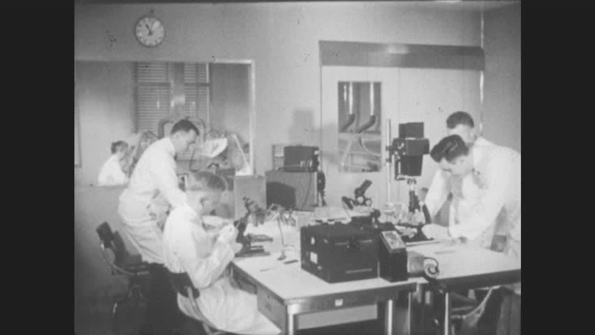 1960s: Bustling Office, Group Of Men Look Busy Working. Man Talks On ...