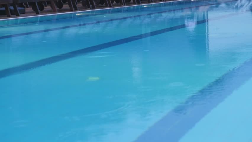 heavy rain falls into a swimming pool sound of rain falling 4k stock footage - Olympic Swimming Pool Underwater heavy rain falls into a swimming pool sound of rain falling 4k stock footage - Olympic Swimming Pool Underwater