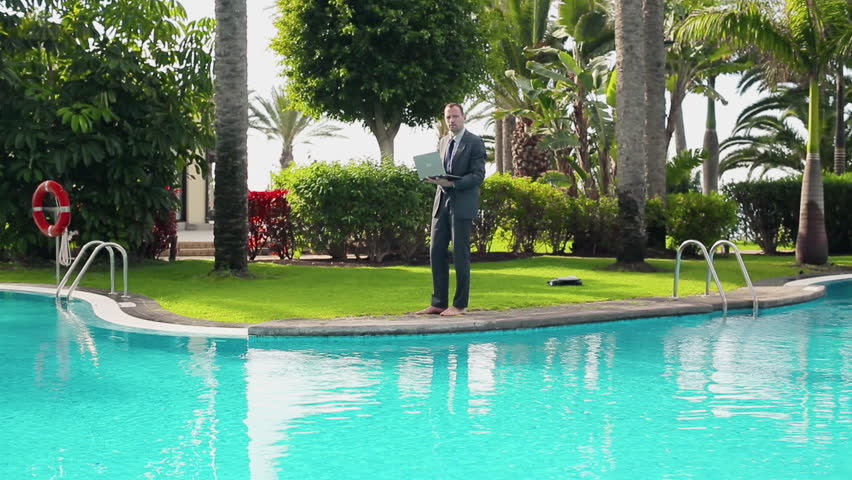 Businessman Walking By the Poolside Stock Footage Video (100% Royalty ...