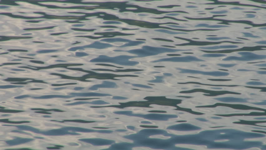 Calm Water Texture sunlight at sunset reflectedcalm water, with glimmering and Calm Water Texture sunlight at sunset reflectedcalm water, with glimmering and