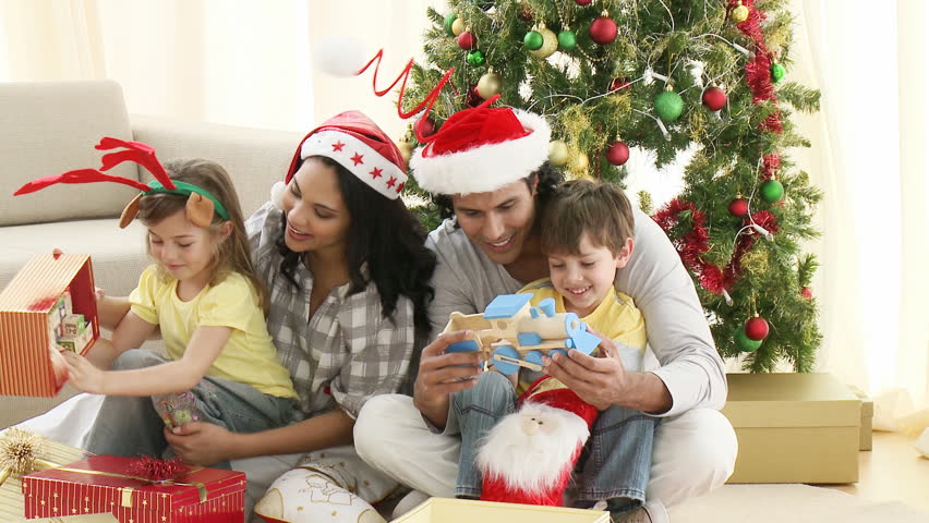 Family Opening Christmas Gifts At Home. Footage In High Definition ...