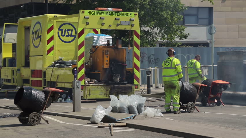 NEW YORK - FEB 15, 2015: FDNY Firefighters Talking In Group Huddle Down
