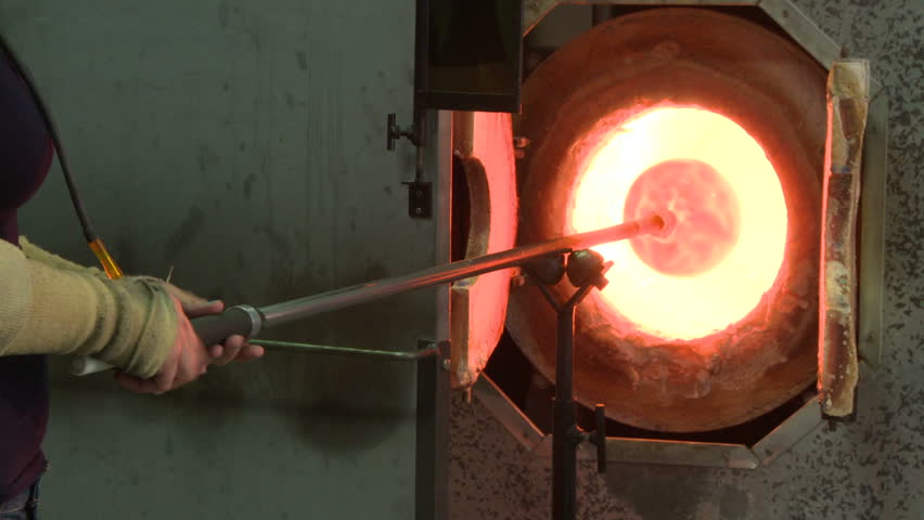 Glassblower Heating a Large Glass Stock Footage Video (100% Royalty