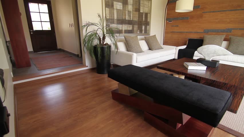 Modern Furniture Video wood floor of a new house with modern furniture. dolly shot. stock Modern Furniture Video wood floor of a new house with modern furniture. dolly shot. stock