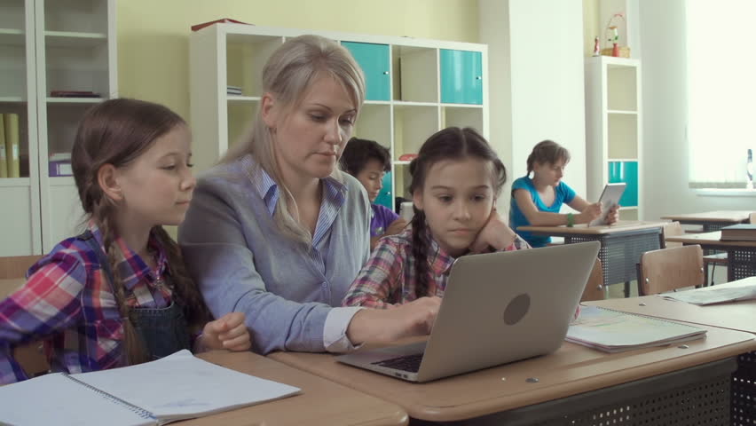 Students Taking Notes And Teacher Using Tablet Pc In Ultra Hd Format ...