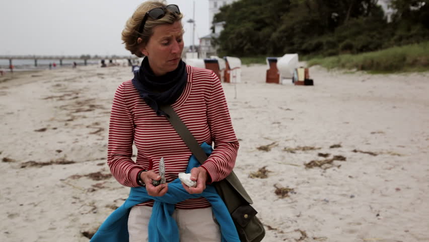 Funny Mature Adult Woman Dancing On The Beach Having Fun Funny Mature Adult Woman Dancing On The Beach Having Fun