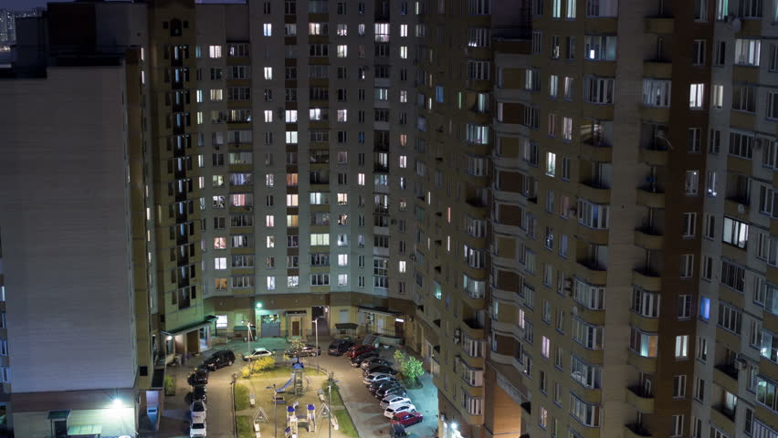 Apartment Building At Night high-rise apartment building with illuminated windows at night Apartment Building At Night high-rise apartment building with illuminated windows at night