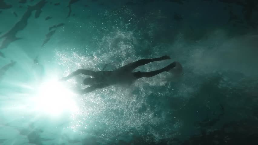 Young Man Swimming Silhouette In The Ocean Underwater Shot Slow Motion ...