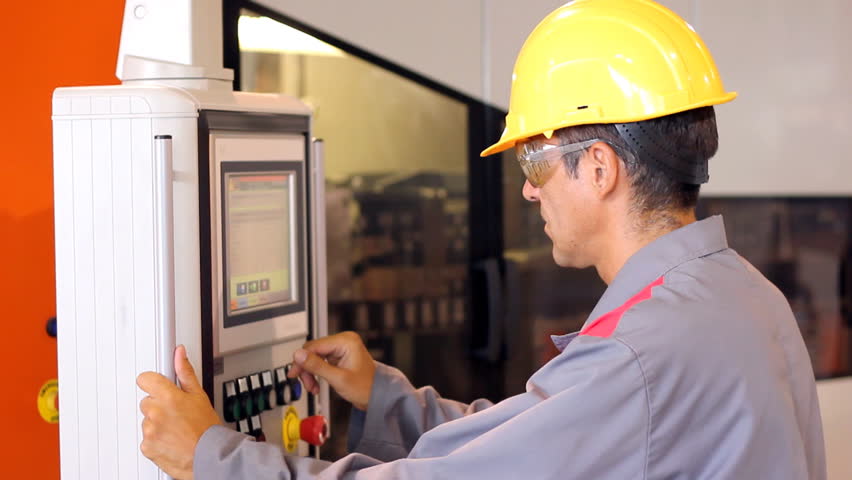 industrial worker cnc machining machine stock footage video (100cnc machining machine operator male worker using industrial control panel of the pet blow molding machine