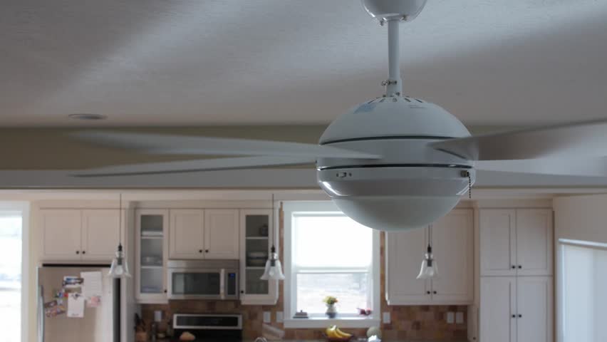 A Ceiling Fan Turns Slowly With Light Stock Footage Video 1967935 A Ceiling Fan Turning On The 4k Stock Video Clip