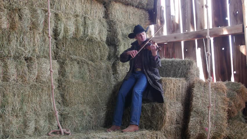 A Cowboy Plays The Fiddle Stock Footage Video 100 Royalty Free